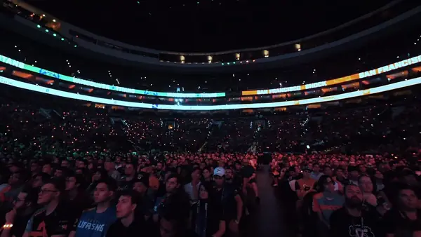 A large esports audience watching a match in an arena